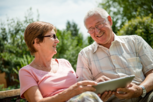 Older man and women using tablet